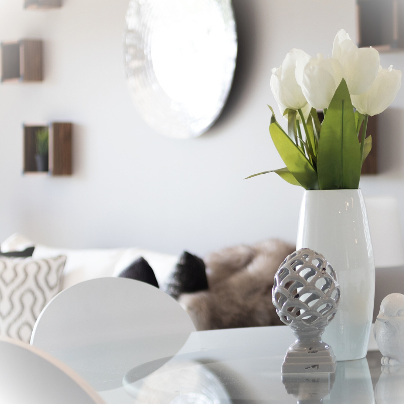 Staging and Design Clean and modern kitchen table with view of living room